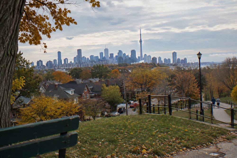 Riverdale rooftops and the downtown Toronto skyline from Riverdale Park in autumn